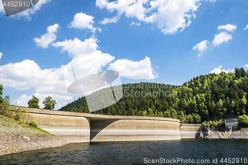 Image of River with a dam surrounded by hills