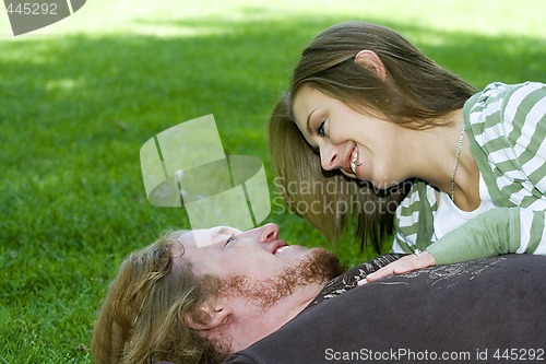 Image of Young couple hugging in a park