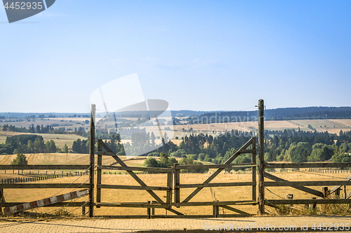 Image of Wooden gate at a ranch