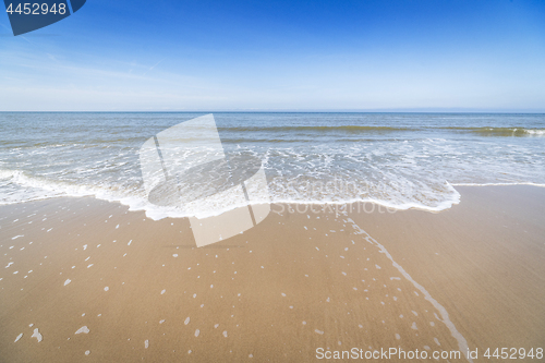 Image of Beach with small waves coming in on the shore