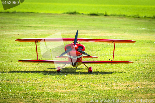 Image of Red veteran plane ready to take off