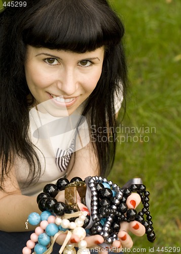 Image of young brunette with beads