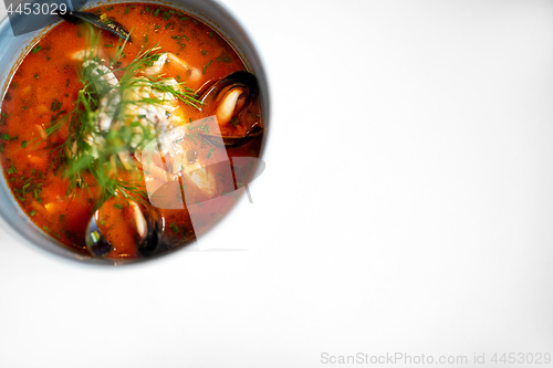 Image of seafood soup with fish and blue mussels in bowl