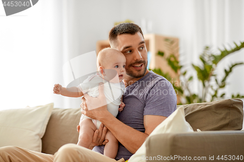 Image of father with little baby girl at home