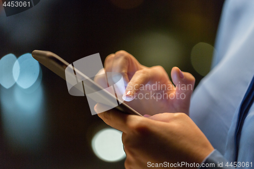 Image of close up of businesswoman hands with smartphone