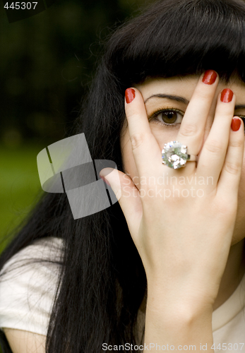 Image of  girl covering her face