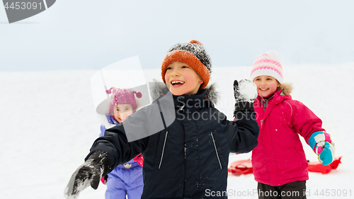 Image of happy little kids playing outdoors in winter