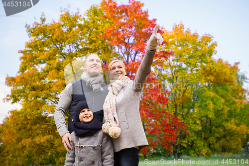 Image of happy family over autumn park background