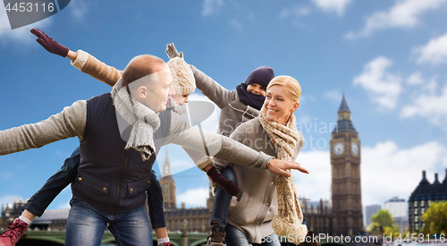 Image of happy family having fun in london city