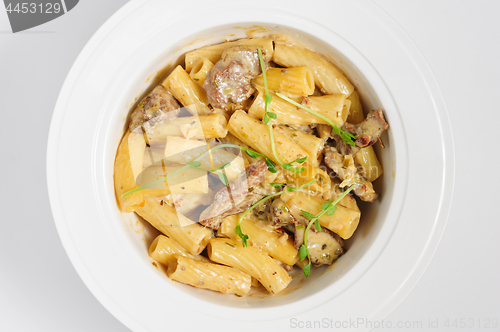 Image of penne pasta with veal meat