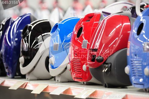 Image of Row of vacuum cleaners in appliance store