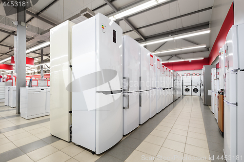 Image of refrigerators and washing mashines in appliance store