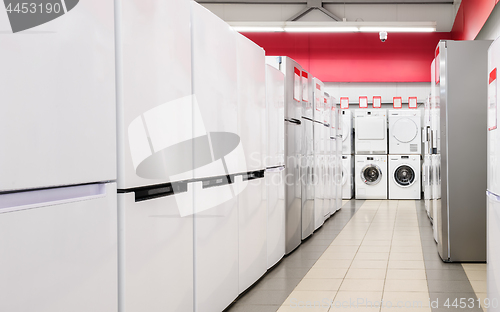 Image of refrigerators and washing mashines in appliance store