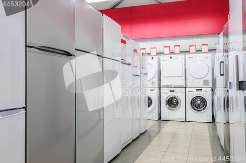 Image of refrigerators and washing mashines in appliance store