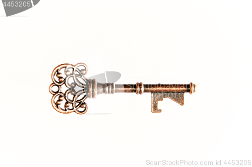 Image of Brass key on white
