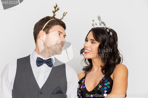 Image of couple with christmas or new year party props