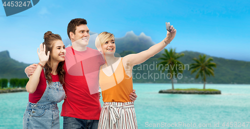 Image of friends taking selfie by smartphone over bora bora