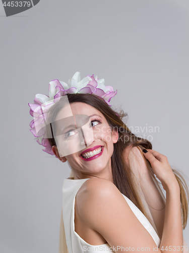 Image of young bride in a wedding dress with a veil