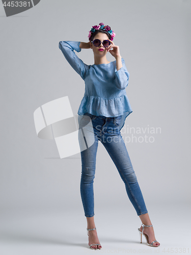 Image of woman posing in fashionable clothes and sunglasses