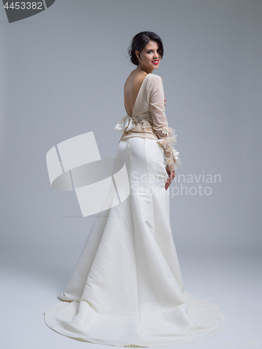 Image of Rear view of a beautiful young woman in a wedding dress