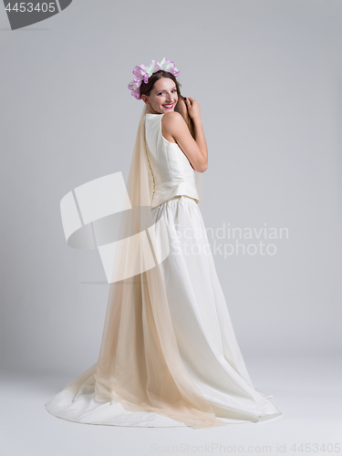 Image of young bride in a wedding dress with a veil