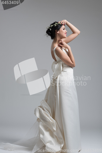 Image of Portrait of beautiful young women in wedding dress