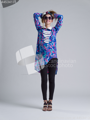 Image of woman posing in fashionable clothes and sunglasses