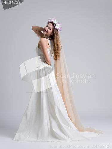 Image of young bride in a wedding dress with a veil