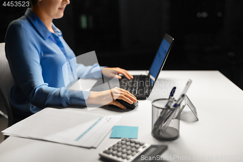 Image of close up of businesswoman using computer mouse