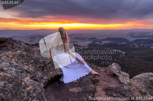 Image of Girl in long white dress watching the sunset at Mt Blackheath