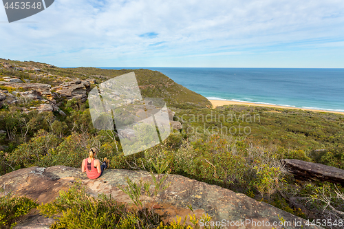 Image of Weekend time, relaxing on a rocky ledge near the ocean