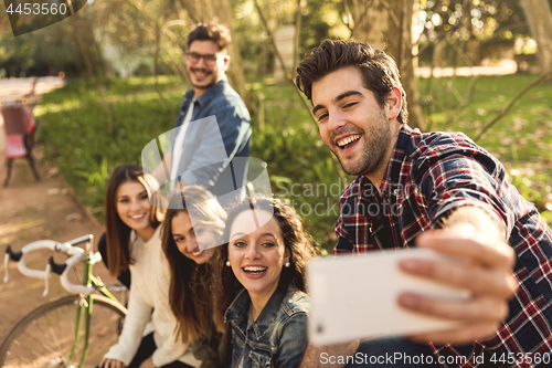 Image of Friends in the park making a selfie