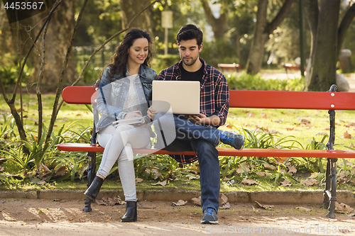 Image of Friends studying in the park