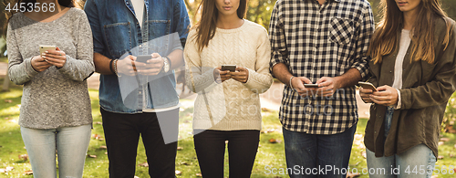Image of Friends distracted with social networks