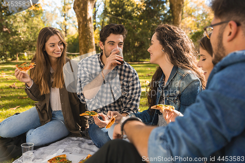 Image of Friends eating pizza