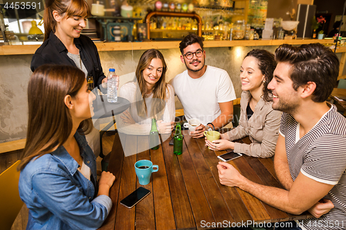 Image of Talking to the waitress