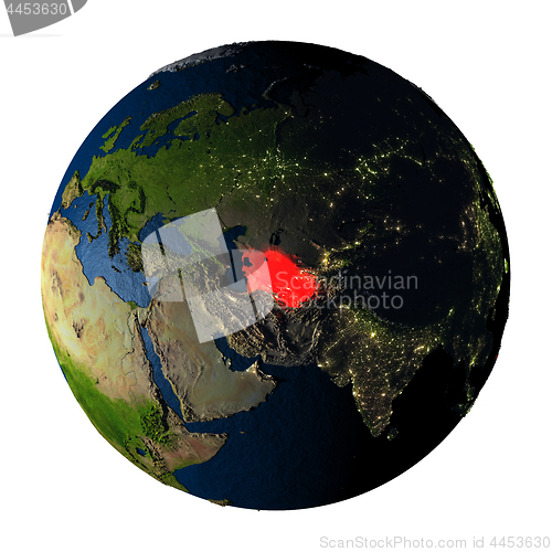 Image of Turkmenistan in red on Earth isolated on white