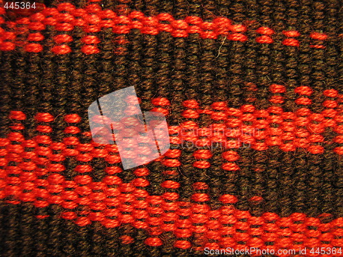 Image of Close-up photo of red and black hand loomed fabric