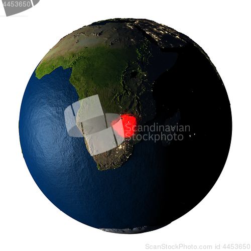 Image of Zimbabwe in red on Earth isolated on white