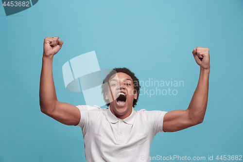 Image of Winning success man happy ecstatic celebrating being a winner. Dynamic energetic image of male model