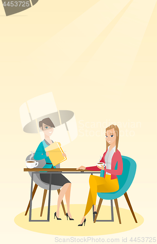 Image of Two businesswomen during business meeting.