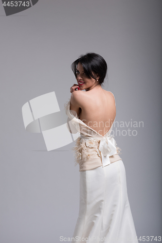 Image of Rear view of a beautiful young woman in a wedding dress