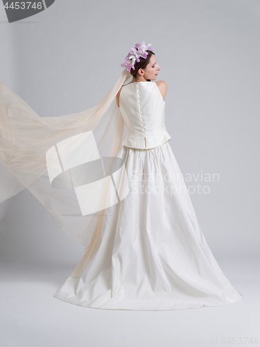 Image of Rear view of a beautiful young woman in a wedding dress