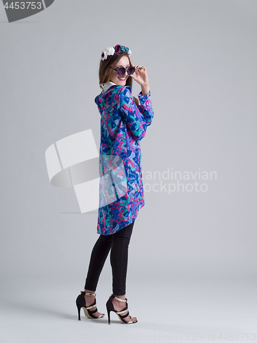 Image of woman posing in fashionable clothes and sunglasses