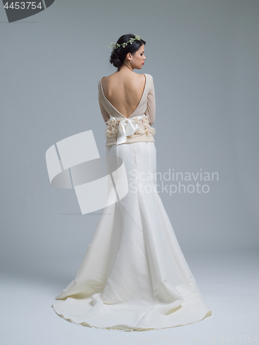 Image of Rear view of a beautiful young woman in a wedding dress
