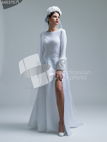 Image of young bride in a wedding dress with a veil