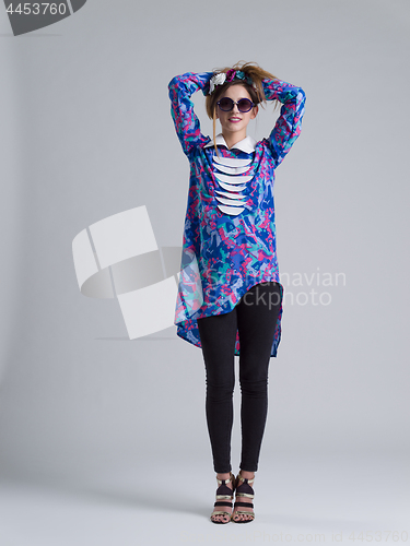 Image of woman posing in fashionable clothes and sunglasses