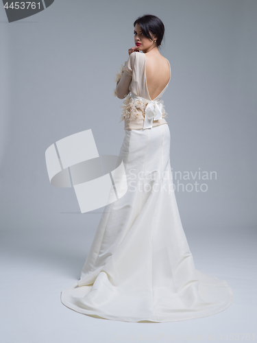 Image of Rear view of a beautiful young woman in a wedding dress