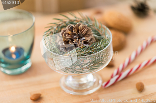 Image of christmas fir decoration with cone in dessert bowl