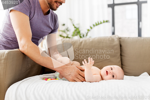 Image of close up of father with little baby at home